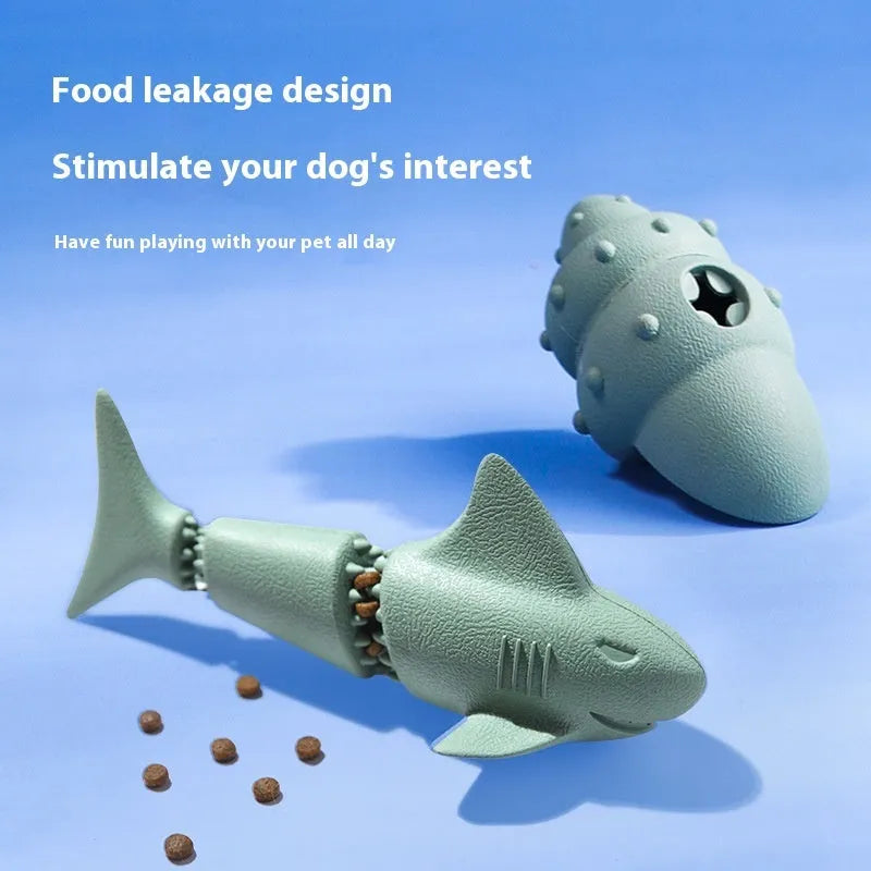 Blue shark-shaped rubber dog chew toy on a white background