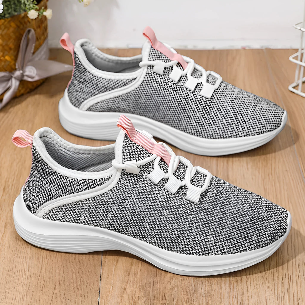 Women's low-top casual sneakers with flyknit mesh upper in black, pink, or grey.