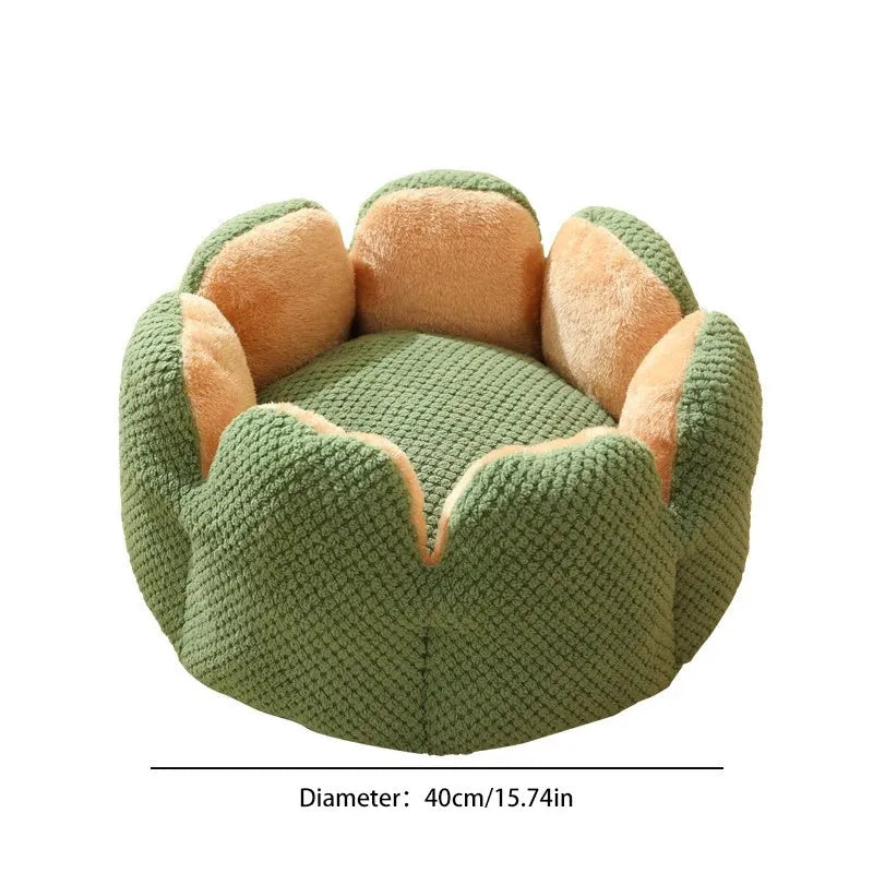 Green cactus petal-shaped soft plush pet bed for cat or dog on a hardwood floor.