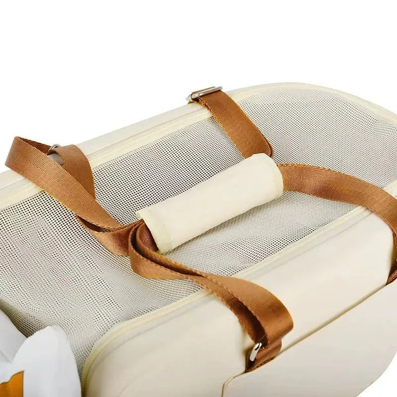 Beige hard-shell pet flight case with one-shoulder carry strap and EPE padded interior