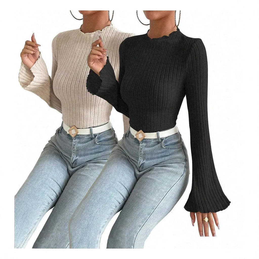 Black long sleeve slim fit top with lantern sleeves and a sunken stripe pattern