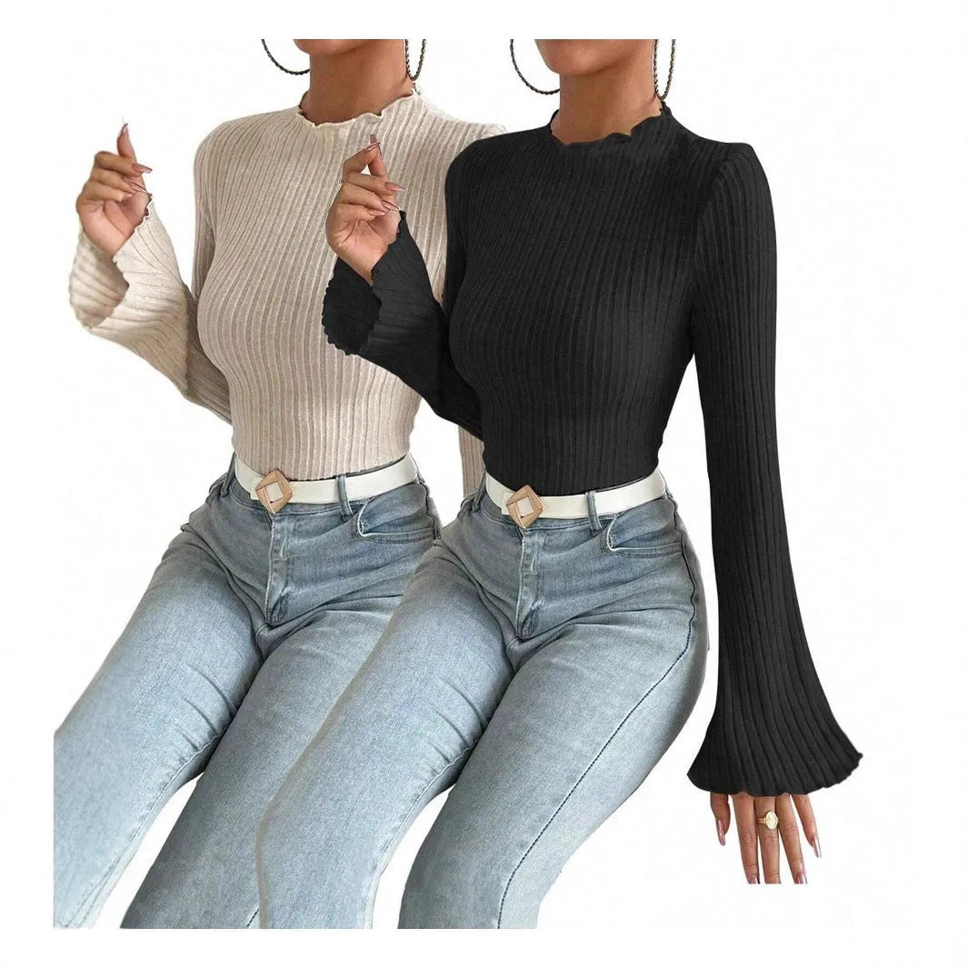 Black long sleeve slim fit top with lantern sleeves and a sunken stripe pattern