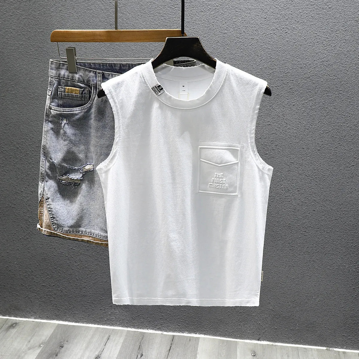 Cotton sleeveless fitness t-shirt in solid black colour showing loose fit and straight hem design