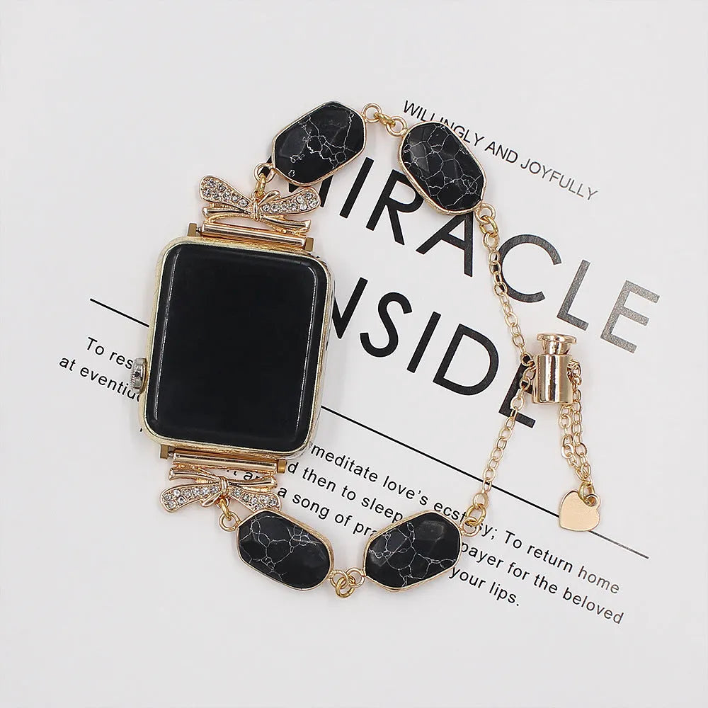 Alloy watch strap with stone detail, shown in black, blue, or white, available in 38mm and 42mm sizes.