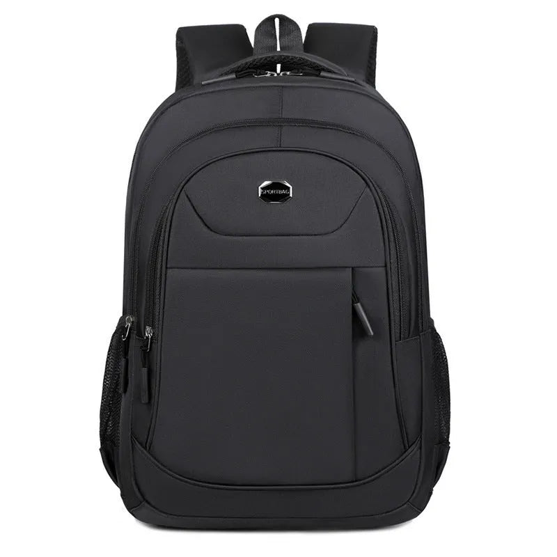 Solid colour Oxford cloth student backpack with curved shoulder straps and multiple storage compartments.