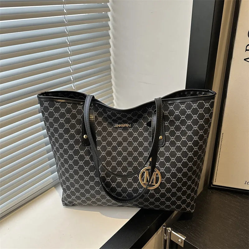 Street style PU shoulder bag with adjustable strap in black colour showing sewing thread detail