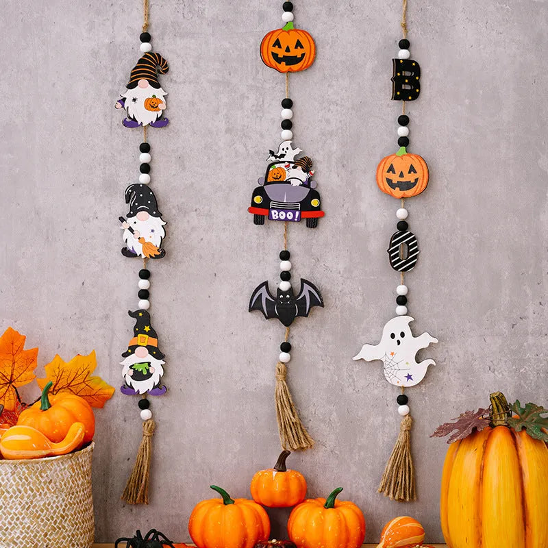 Resin Halloween pendant string with BOO ghost design hanging on a wall