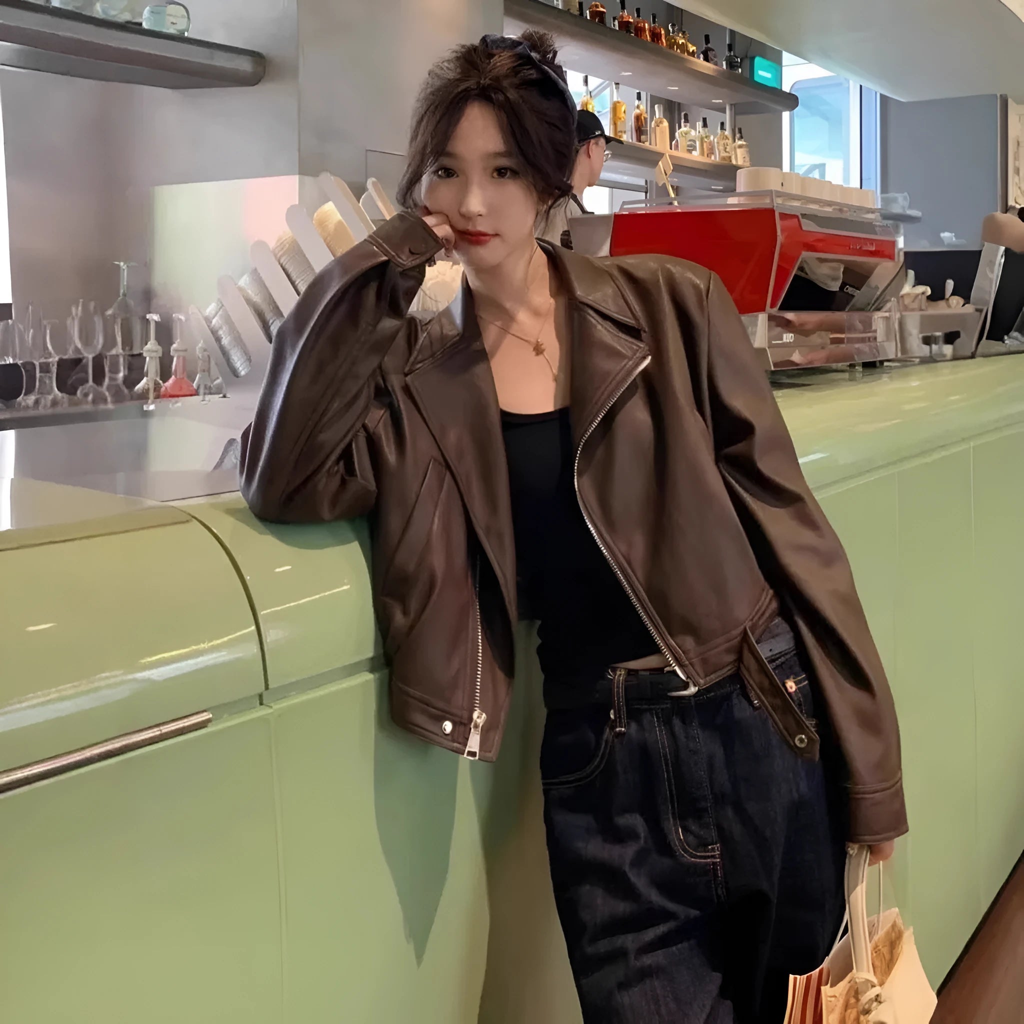 Women's brown retro leather coat jacket with slim fit design and pocket detailing