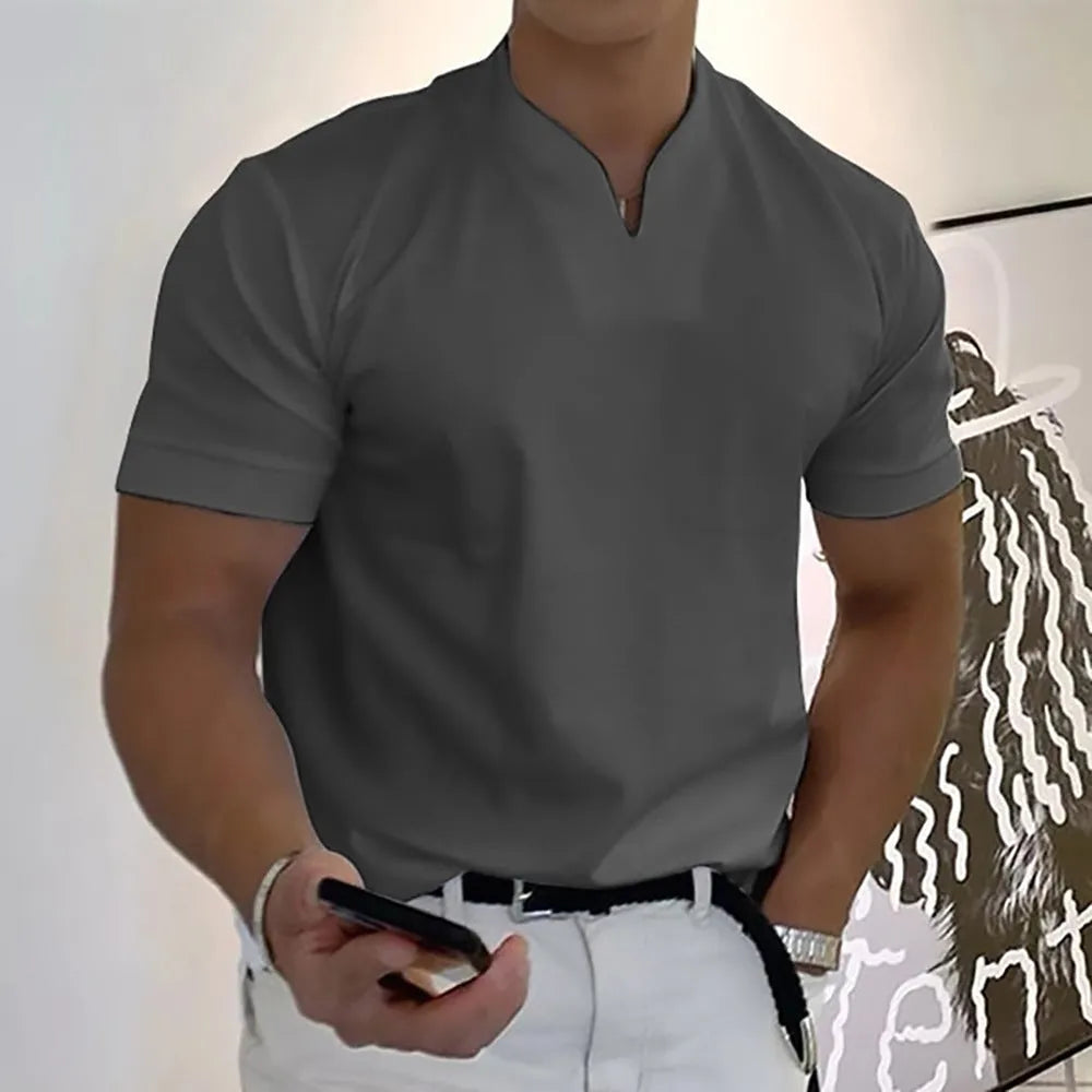 Men's loose fit short sleeve sports T-shirt with stand collar and pocket, available in 12 colours and sizes S to 5XL.