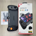 Black and white portable gamepad handle for Nintendo Switch console with integrated charging port.