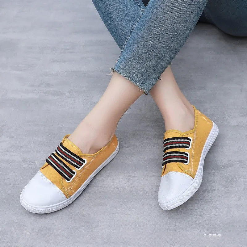 Breathable non-slip slip-on canvas sneakers with flat heel and round toe in black, white, or yellow