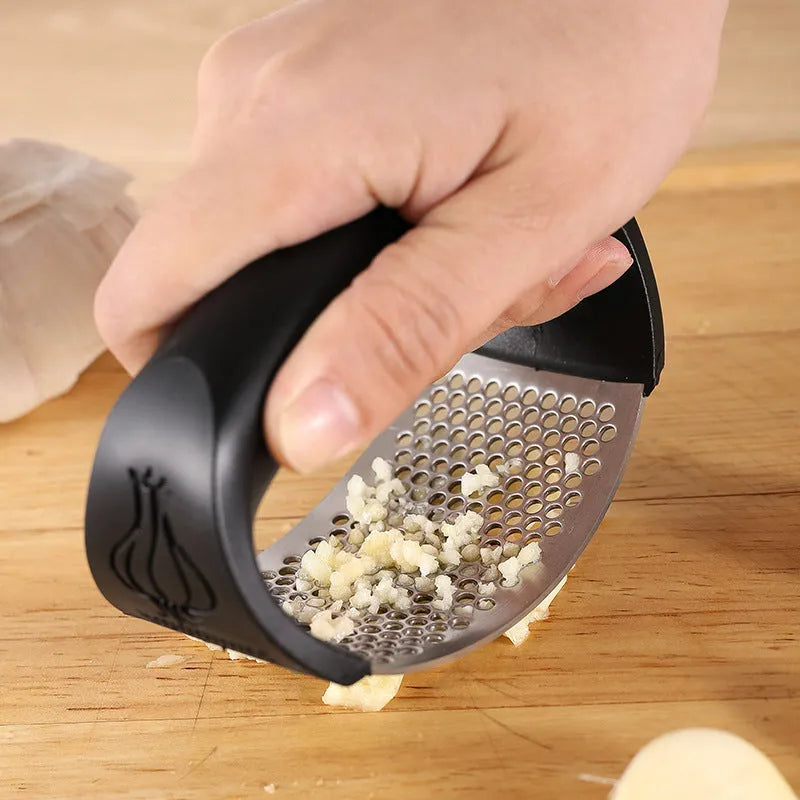 304 stainless steel garlic press in four colour options showing modern design and compact 11 by 7cm dimensions