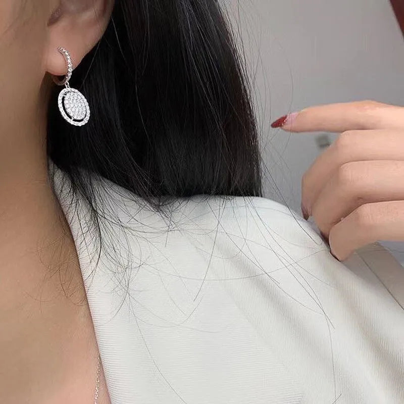 White gold plated oval earrings for women with copper base and geometric European American style, one pair