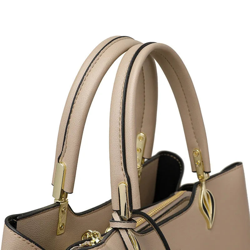 Women's black PU leather messenger bag with multi-layer shoulder strap and sewing thread detailing
