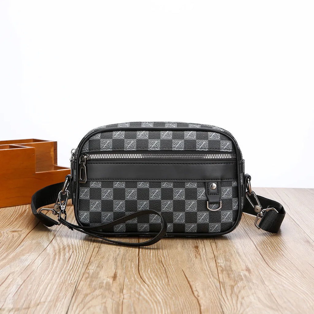 Men's black PU leather messenger bag with geometric pattern, showing horizontal shoulder carry design