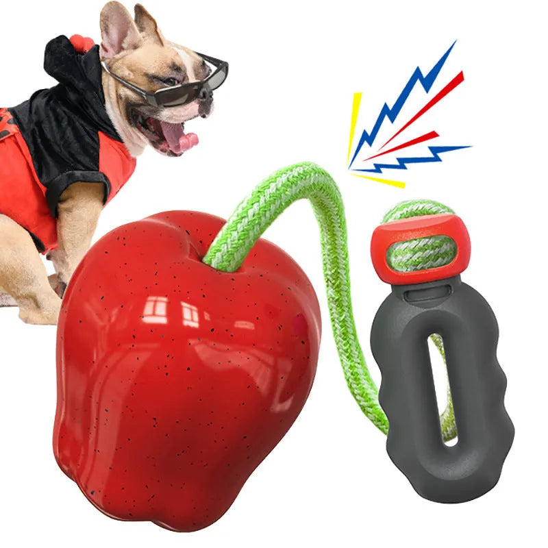 Green apple-shaped plastic dog chew toy with hollow treat-dispensing design
