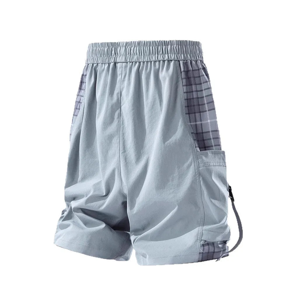 Men's black loose-fit cargo shorts with plaid stitching on the legs