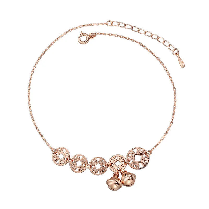 Rose gold stainless steel anklet with coin charms and small bells on adjustable link chain