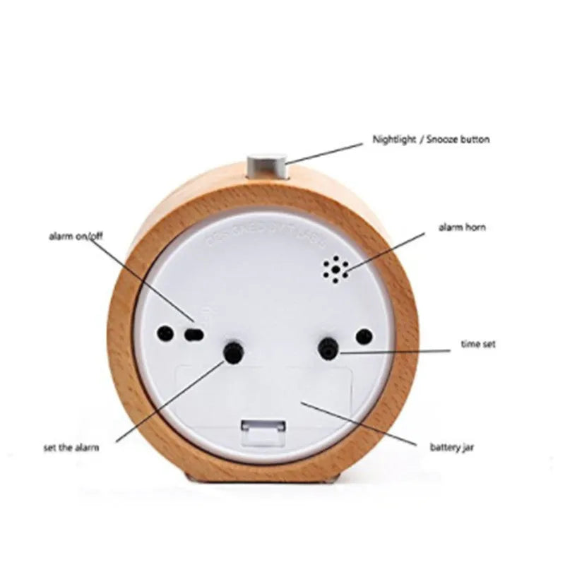 Solid beech wood analogue alarm clock with silent snooze on a wooden bedside table.