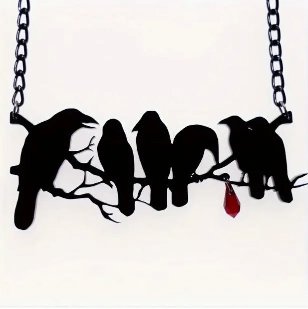 Black alloy crow pendant necklace with electroplated finish and cross chain, gothic bird jewellery.