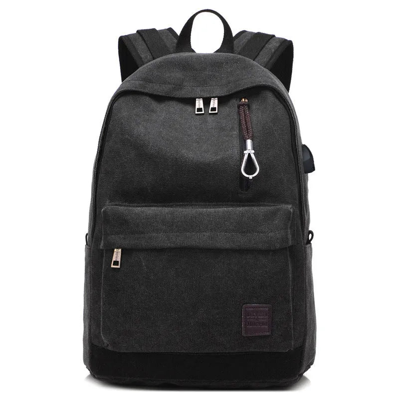 Canvas backpack with USB charging port showing laptop compartment and multiple pockets in grey colour