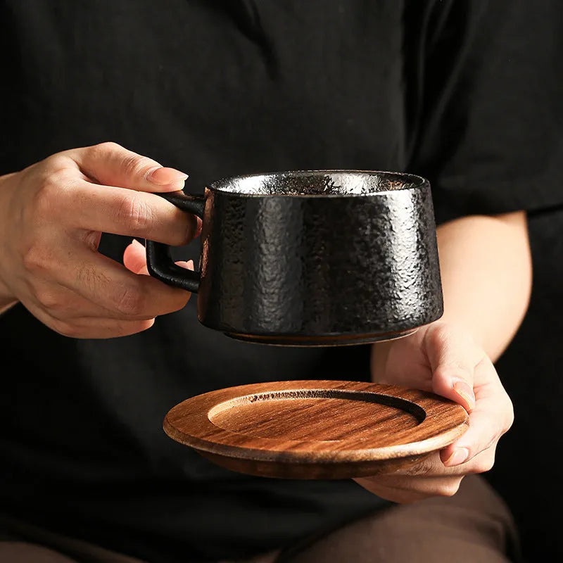Gold-plated gift tumbler cup and box set on a desk