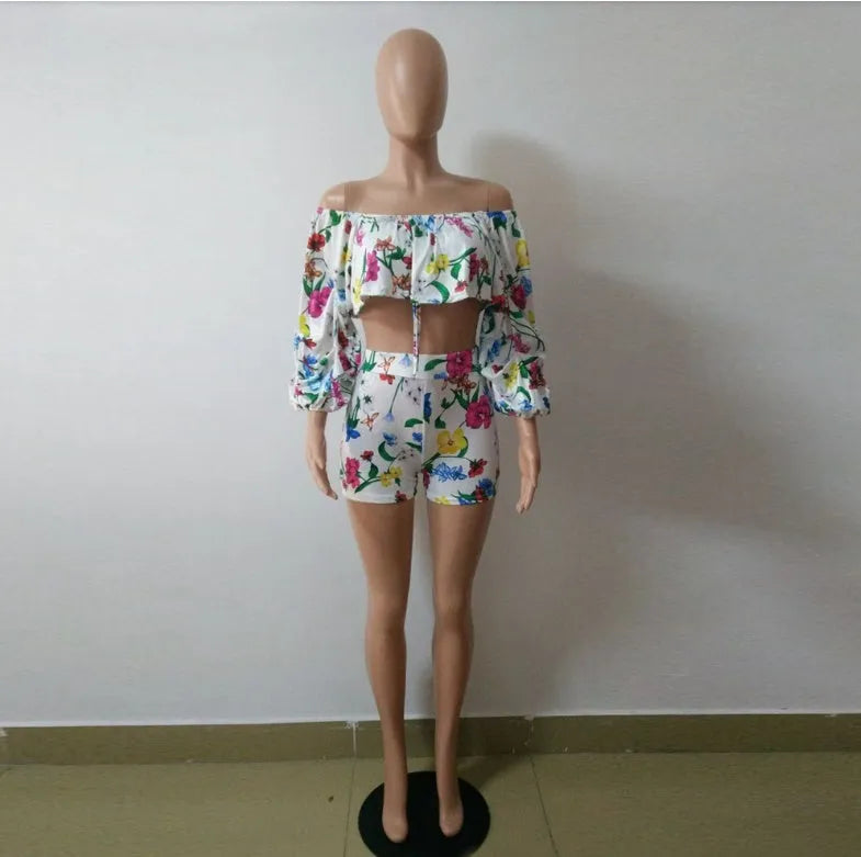 Women's two-piece set with multicolour digital print, pile sleeves on crop top, and matching shorts.