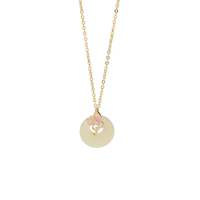 Silver necklace with orchid flower and peace buckle pendant on an O-ring chain, featuring a safety clasp.