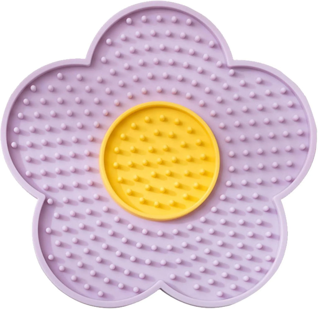 Flower-shaped silicone lick mat for cats and dogs with suction cups on the base, shown in a choice of colours.