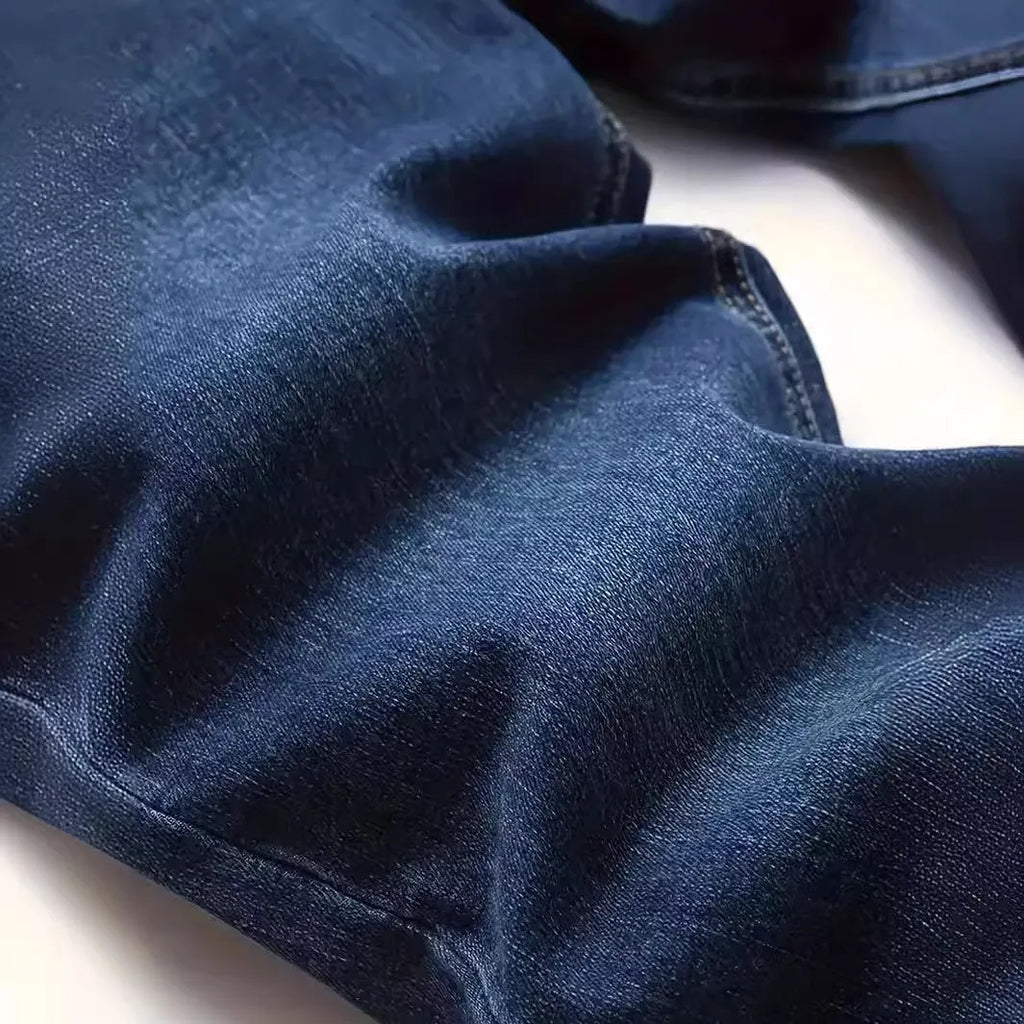 Dark blue men's slim fit skinny jeans with zipper fly on mid waist