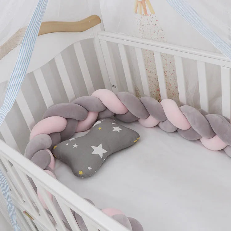 Baby crib bumper braid knot pillow cushion in spandex velvet fabric, shown in a multi-colour option.