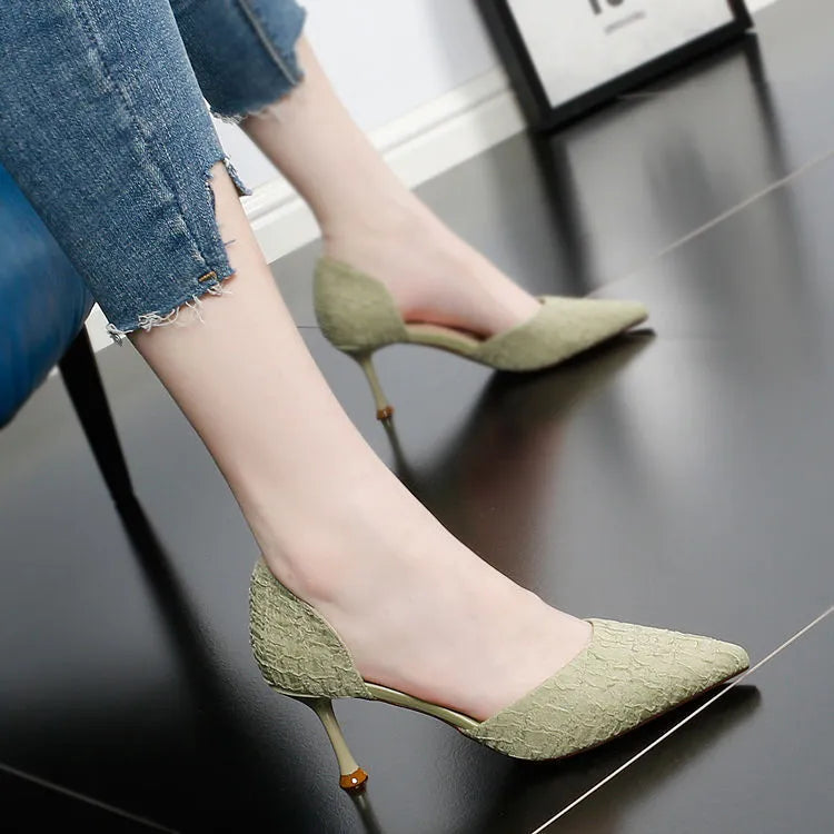 Women's black pointed toe stiletto high heels with PU leather upper and thin heel.