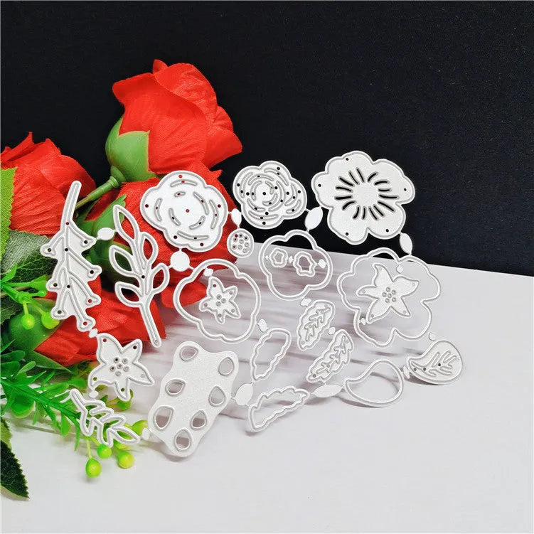 Silver carbon steel flower paper cutting die measuring 14.3 by 9.9 centimetres.