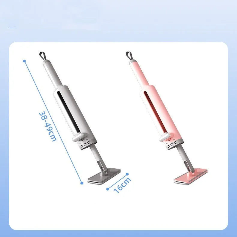 Rotatable self-squeeze mini mop with pink handle, crevice brush, and two microfiber pads on a tiled floor