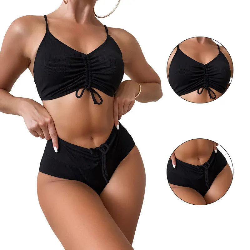 Black women's swimsuit with high waist bottoms and sleeveless top on mannequin