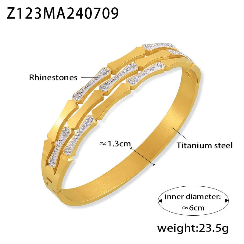 Gold electroplated titanium steel hollow splicing casual bracelet for women, open cuff design on white background