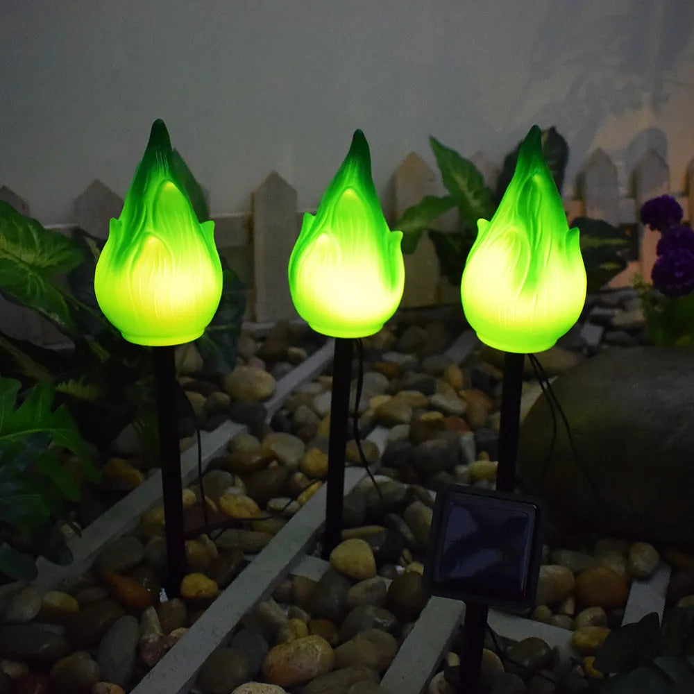 Solar simulation flame lamp with wrought iron frame and yellow flame effect in garden courtyard