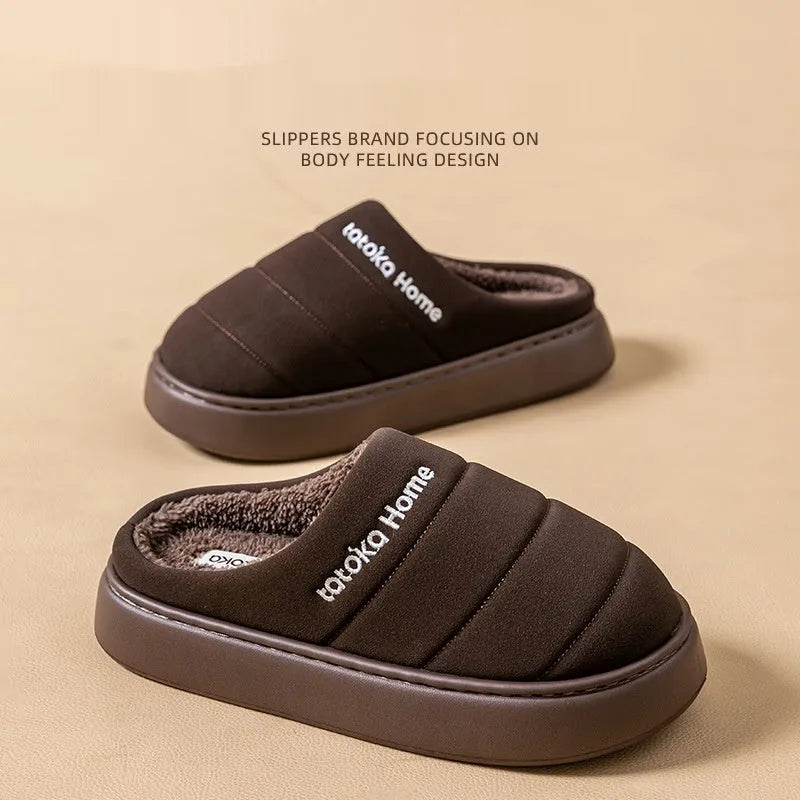 Pair of khaki fleece-lined cotton slippers with round toe and flat platform sole