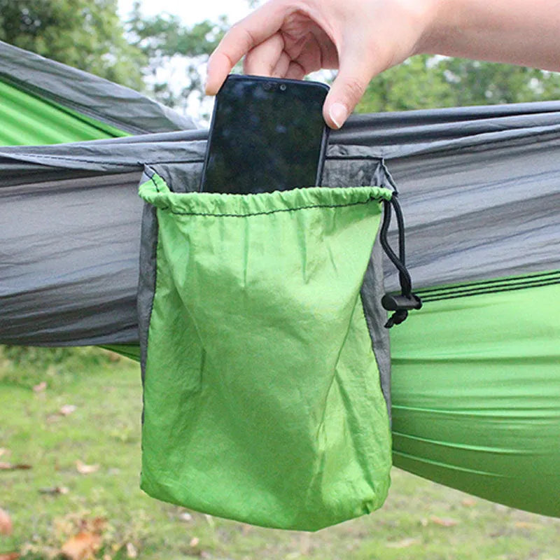Blue nylon parachute cloth outdoor hammock hung between two trees showing full 270 cm length