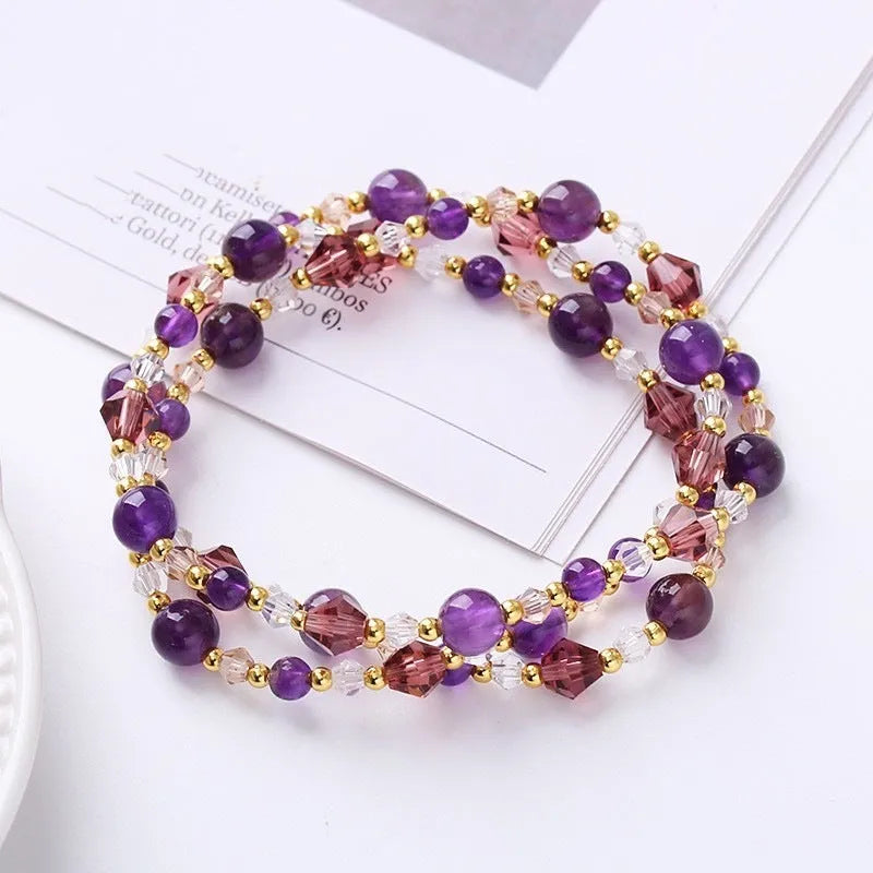 Women's adjustable bracelet with three rings of tourmaline, strawberry quartz, and amethyst crystal beads.