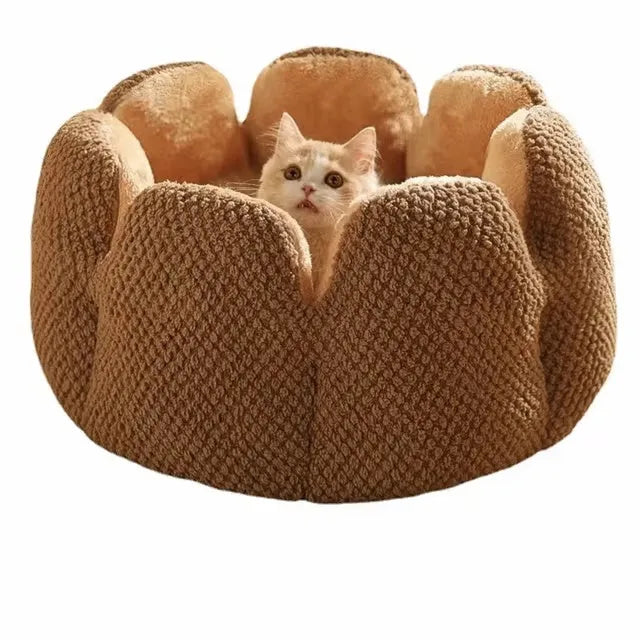Green cactus petal-shaped soft plush pet bed for cat or dog on a hardwood floor.