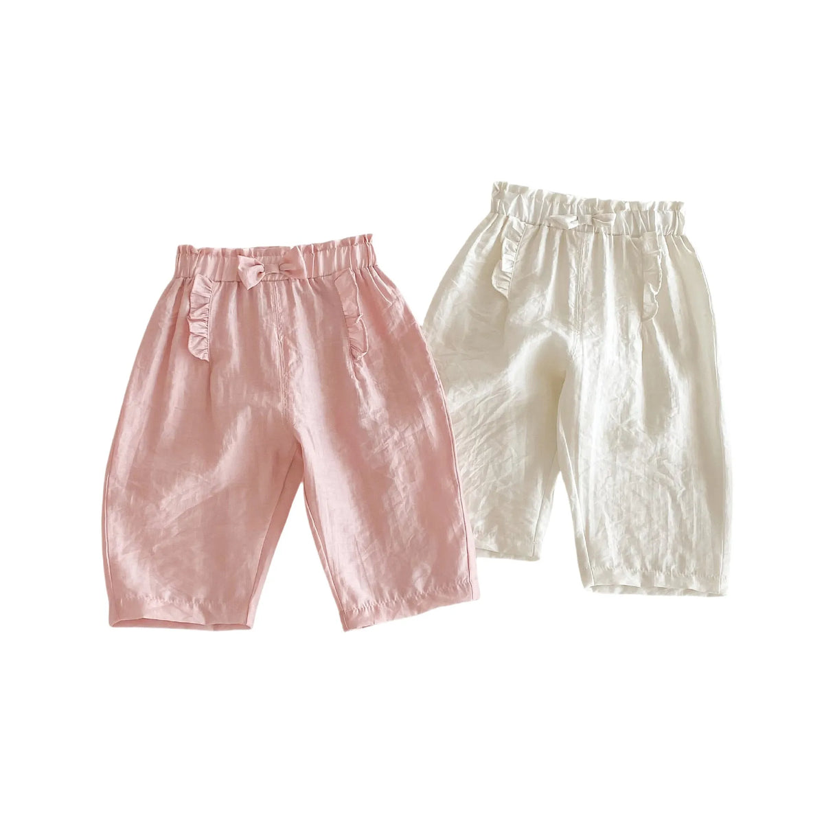 Girls' bow anti mosquito pants in cotton, solid colour, mid waist, available in rubber pink and cream beige, heights 73-120cm.
