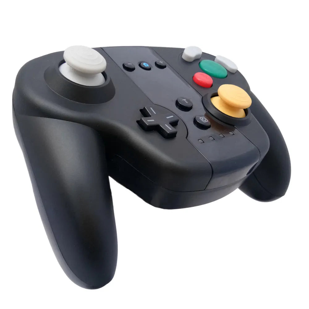 Black wireless gamepad with NFC reader, for Nintendo Switch and Windows PC, beside its USB-C cable and colour packaging box.