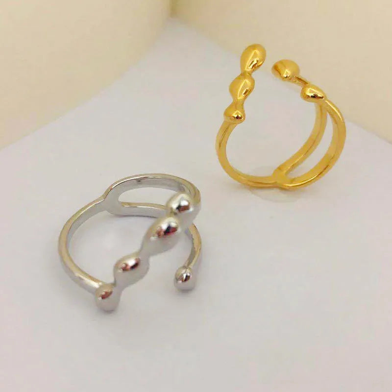 Brass opening ring with spherical design in gold or silver colour for women