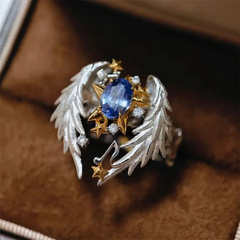 Adjustable angel wing ring with geometric design and open mouth styling