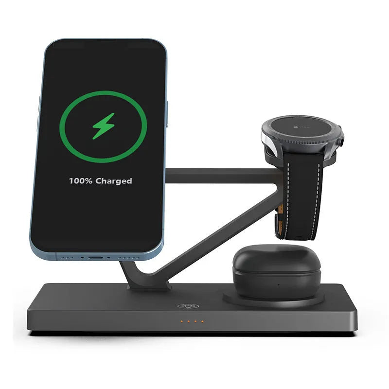 White five-in-one wireless charging station with night lamp, magnetic phone bracket, and watch charging pad on a bedside table.