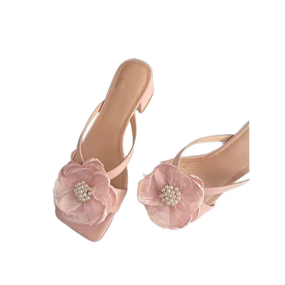 Beige women's sandals with a chunky heel, square toe, and a single satin strap across the foot.