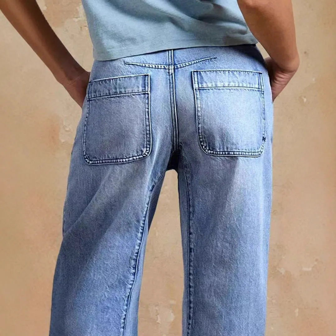 Casual cotton denim loose jeans trousers in light blue with washed finish, street hipster style