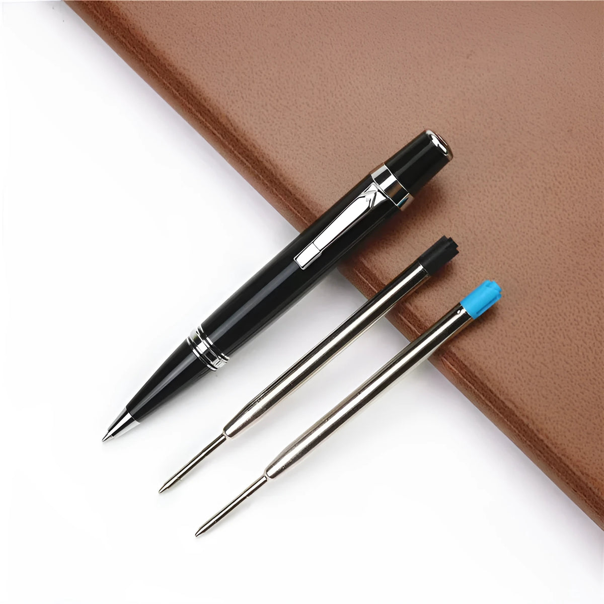 Black metal pocket rollerball pen with two 0.7mm black refills included