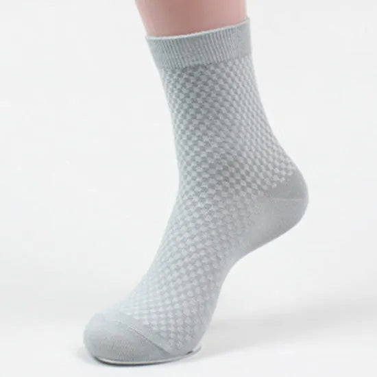 Men's bamboo fibre socks in a small square pattern, shown in neutral colours including grey and navy.